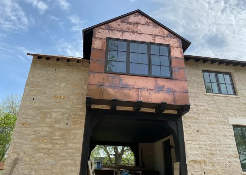 Copper metal panel facade on a stone building for Skylight Installation in Islamorada, Village of Islands